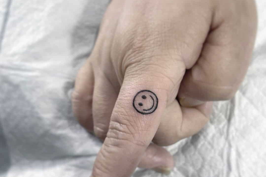 Smile-Tattoo-On-Finger.jpg