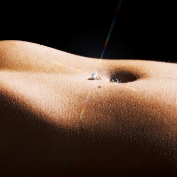 depositphotos_6096865-stock-photo-woman-pierced-belly.jpg