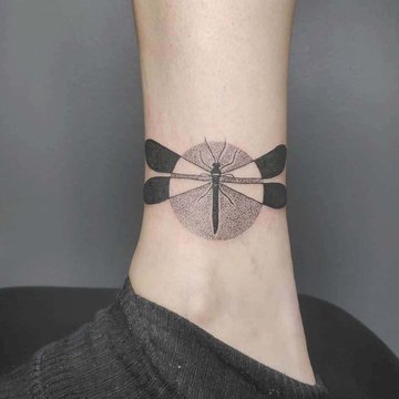 fat-black-negative-space-dragonfly-cicular-framed-fill-intense-dotwork-geometric-tattoo-e1587793227691.jpg