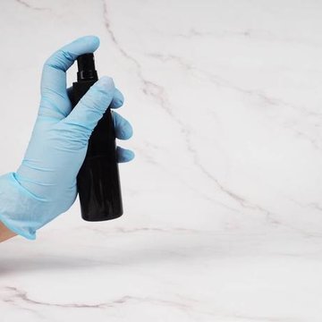 stock-photo-hands-in-medical-gloves-hold