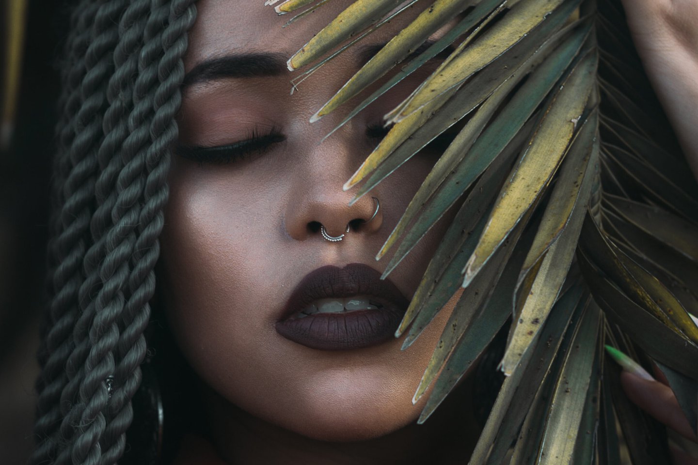 woman-with-braided-hair-touching-leaves-1958587-copia-scaled.jpg